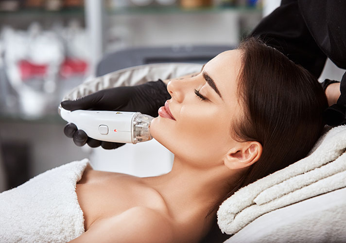 Woman getting laser treatments